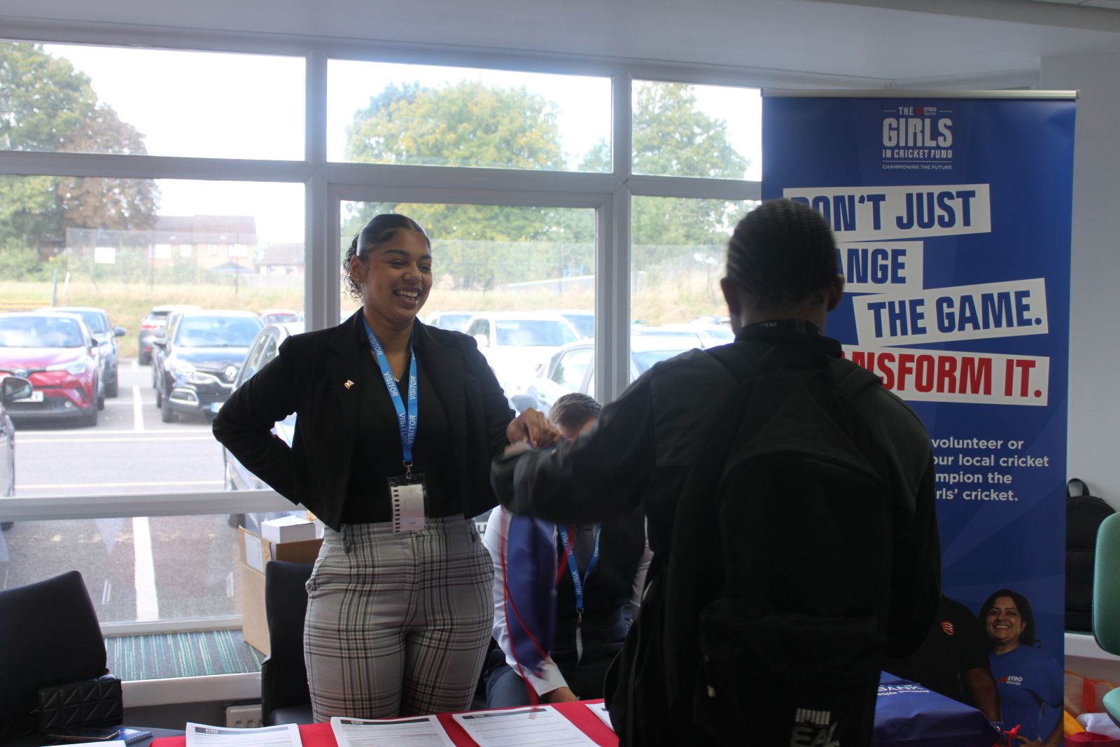 Student speaking with Metro Bank rep