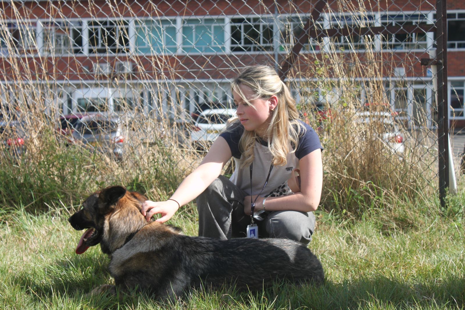 Animal Management Student stroking Dog Unit Puppy